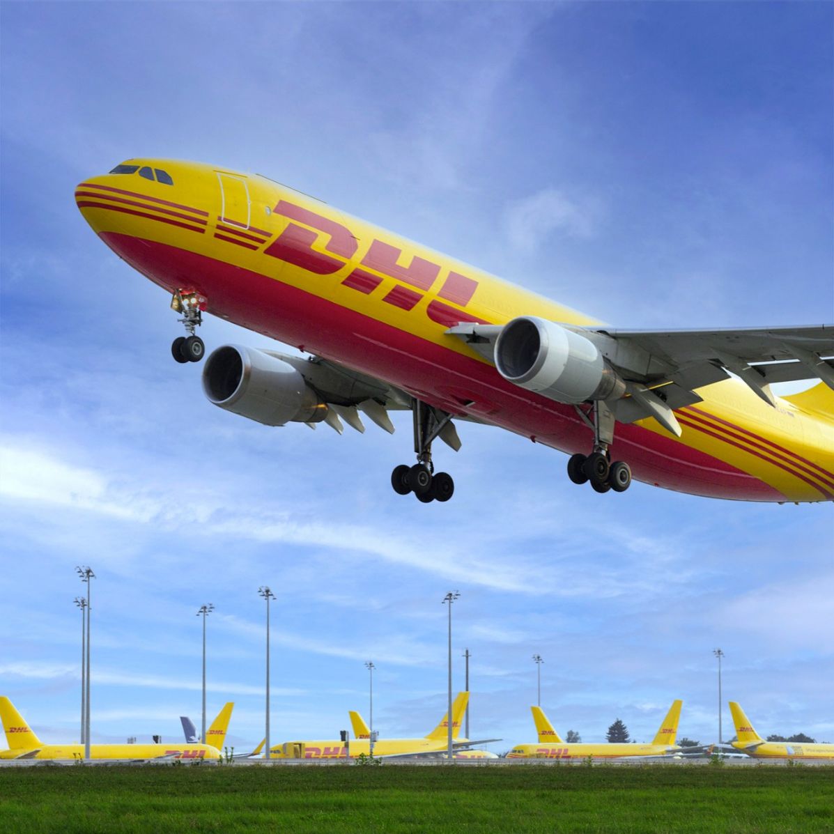 DHL Office in Ibadan. DHL cargo plane taking off with other planes in the background